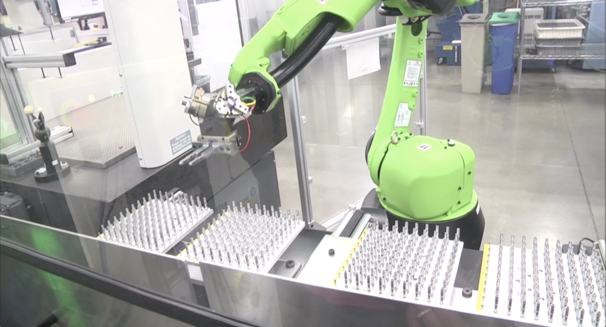 robot performing automation Ultra Machining Company Technology Manufacturing